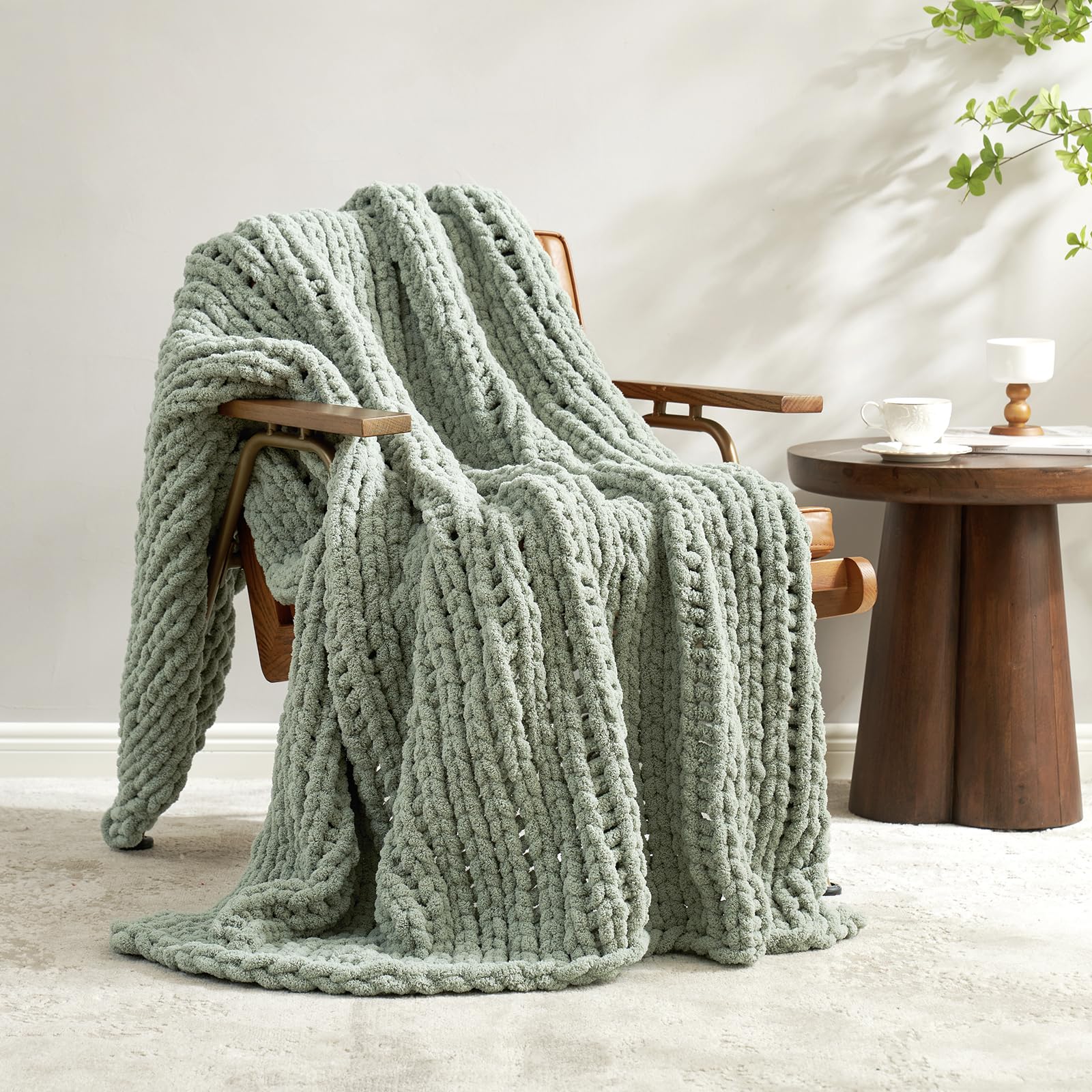 Amélie Home throw front view in sage green showing plush texture and cozy appeal