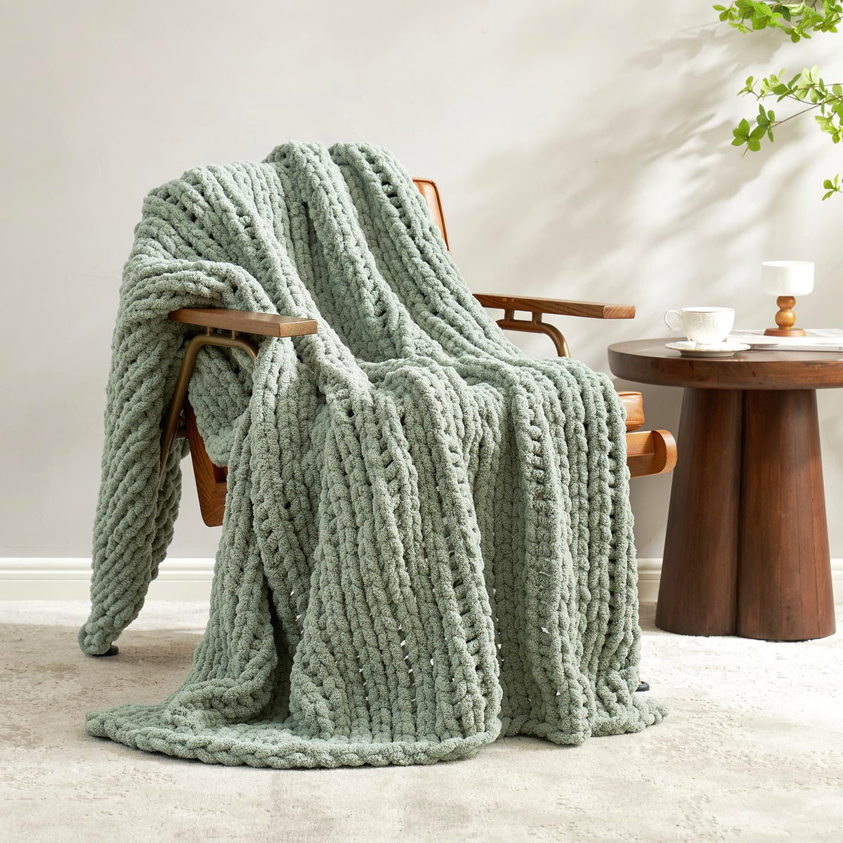 Amélie Home throw front view in sage green showing plush texture and cozy appeal