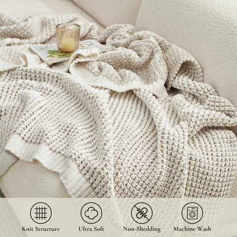 Amélie Home throw draped on sofa suggesting added warmth and stylish decor
