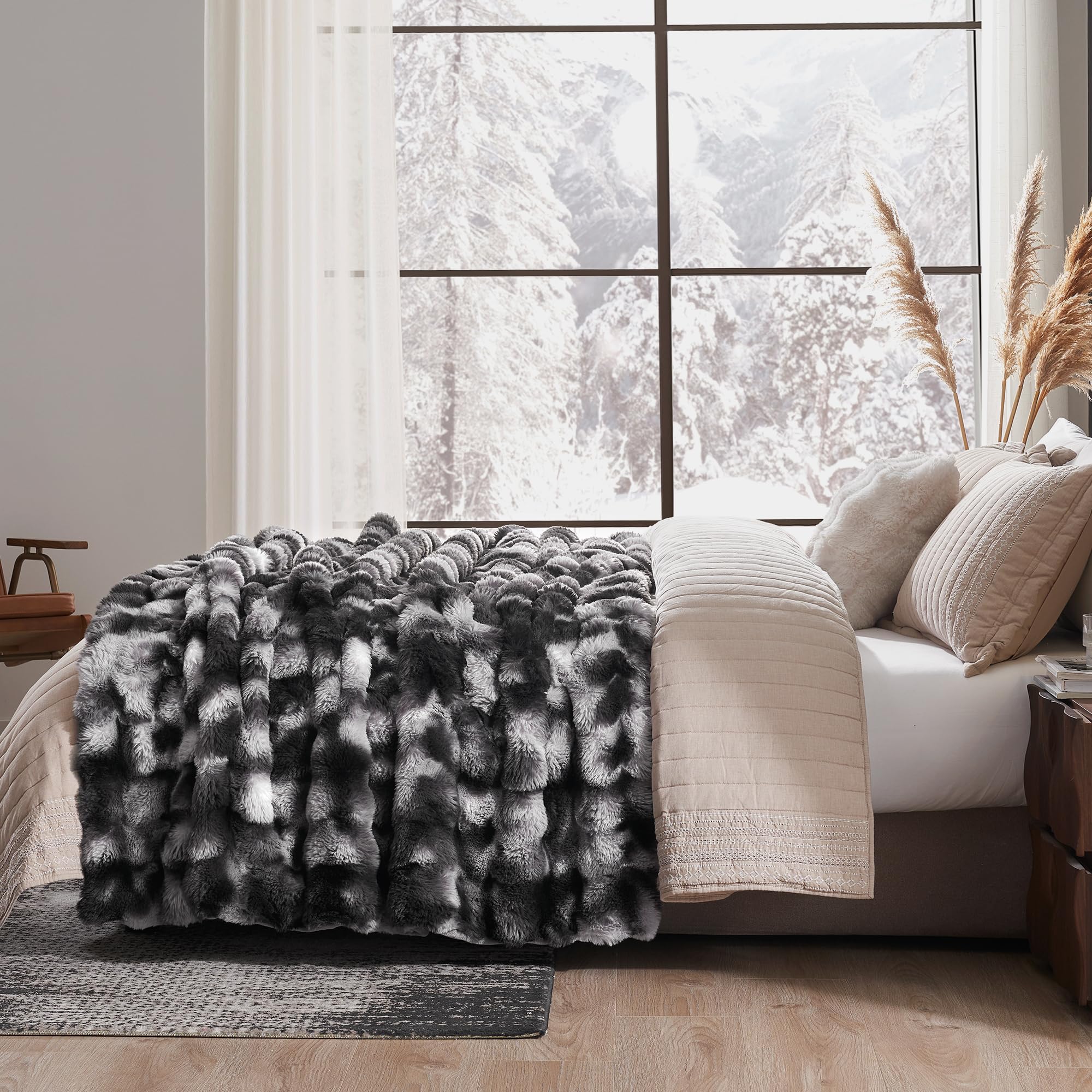 Amélie Home throw styled on sofa adding warmth and modern tie-dye contrast