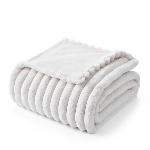 Amélie Home blanket folded in gift packaging ready for giving