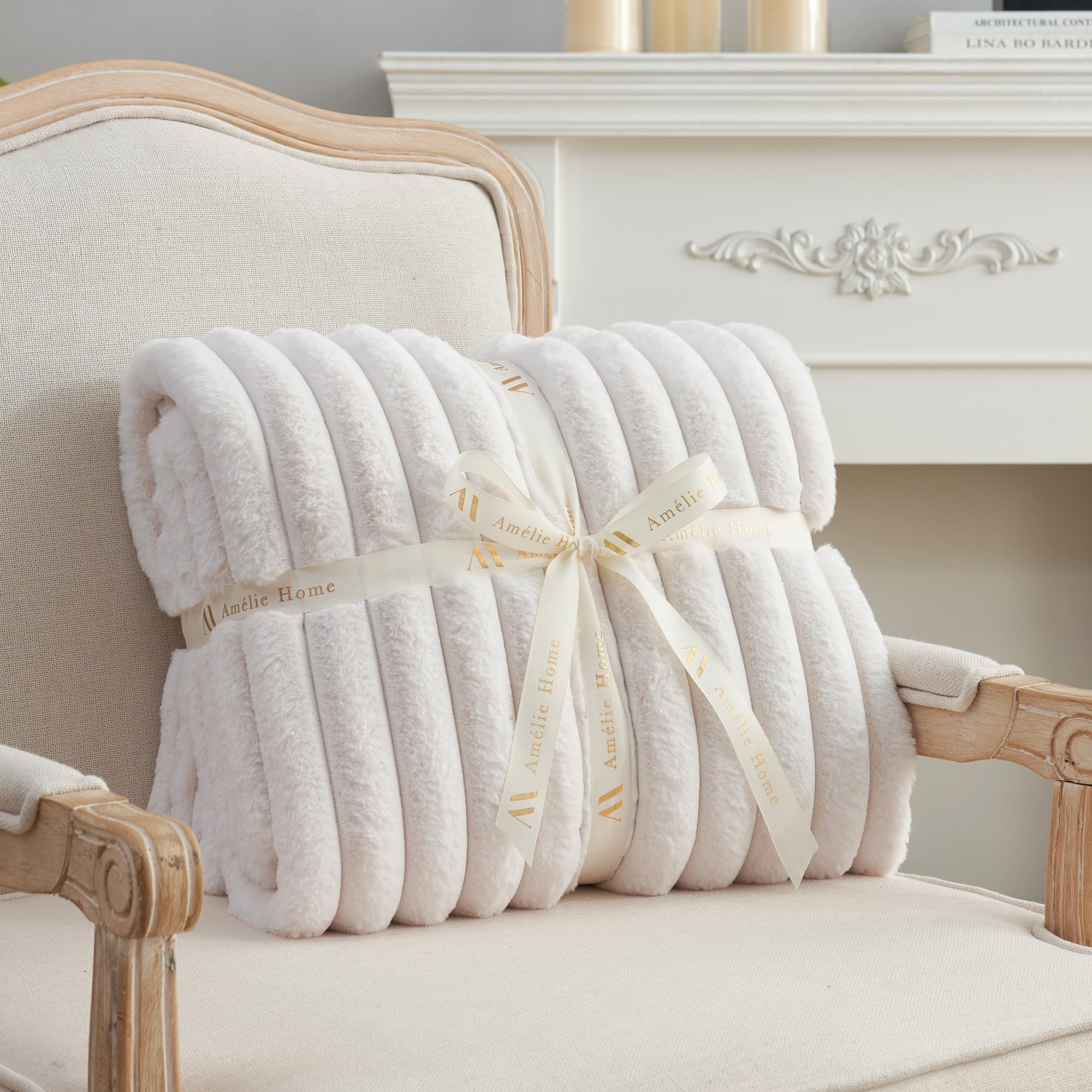 Amélie Home throw next to chair demonstrating oversized coverage benefit