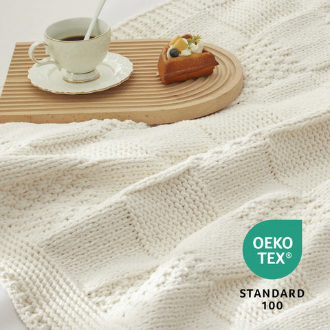 Amélie Home throw beside pillow showing 50x60 scale for accurate sizing
