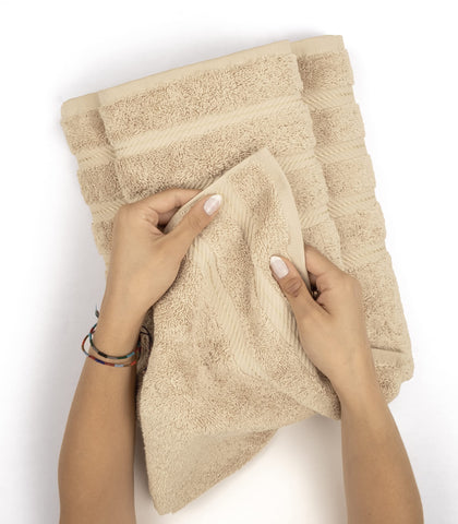 American Soft Linen hand pressing towel showing thickness and cushioned comfort