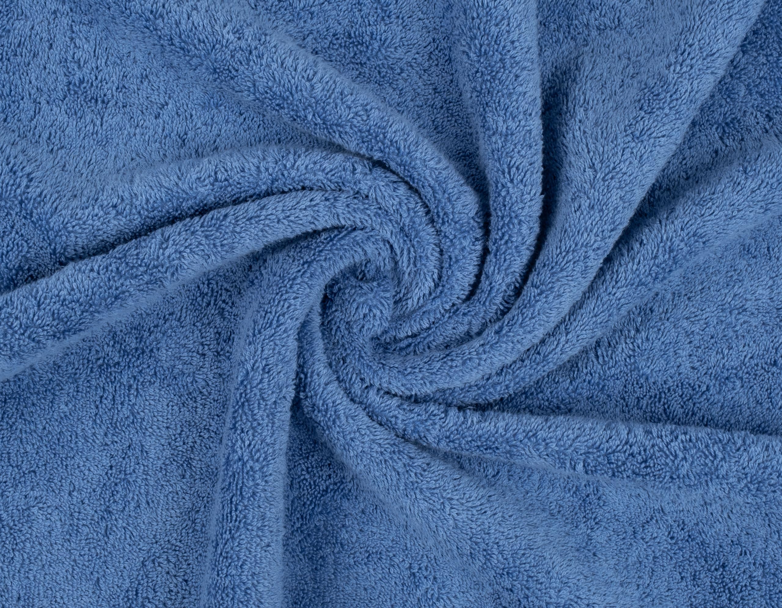 American Soft Linen towels on bed showing scale and generous coverage for body drying