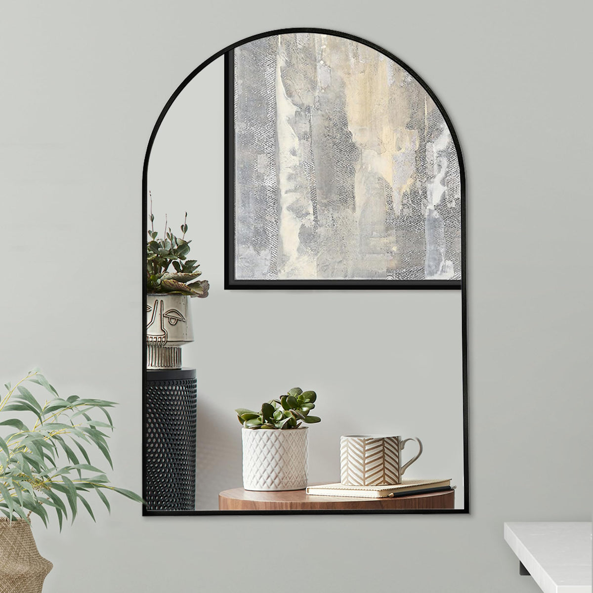 Americanflat arched mirror front view showing sleek black frame and clean reflection benefit