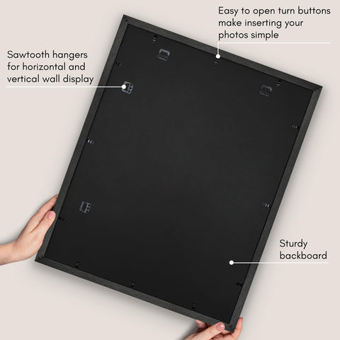 Americanflat frame beside hand for scale illustrating lightweight, easy-to-hang benefit