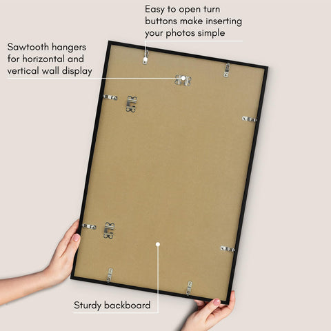 Americanflat frame held in hand to show slim profile and lightweight benefit for easy hanging