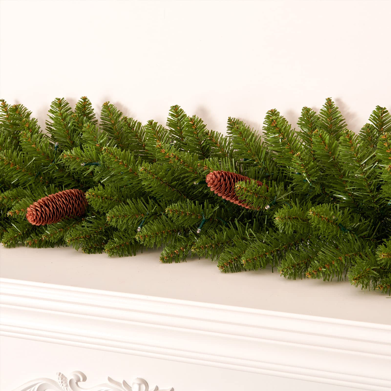 AMERZEST close-up of warm white LED lights glowing on garland for cozy holiday ambiance