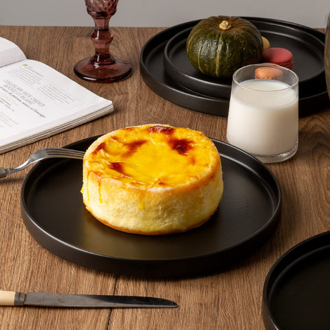 AmorArc plate in a styled table setting showing how matte stoneware enhances food presentation