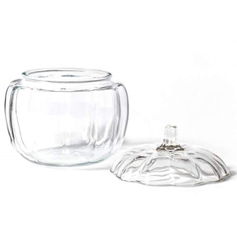 Anchor Hocking pumpkin jar open filled with candies showing easy filling and serving