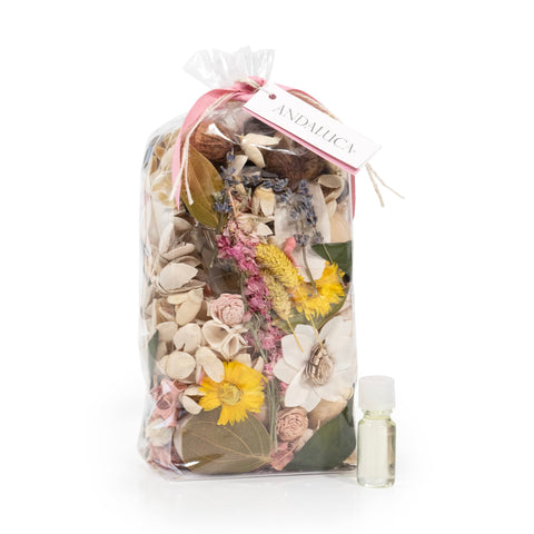 ANDALUCA potpourri in wood bowl on table, creates inviting ambiance