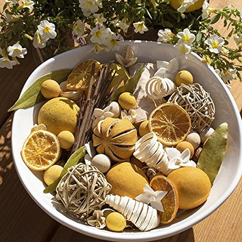 ANDALUCA potpourri arranged in wood bowl on table adding citrus thyme scent and decor appeal