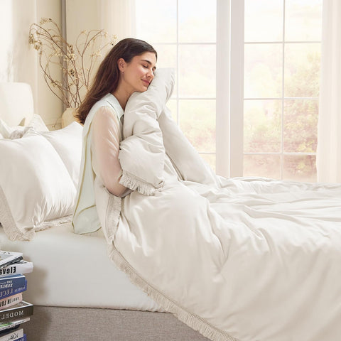 Andency comforter styled in bedroom delivering neutral boho ambience and layering