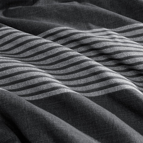 Andency comforter on bed staged to show full-size coverage benefit