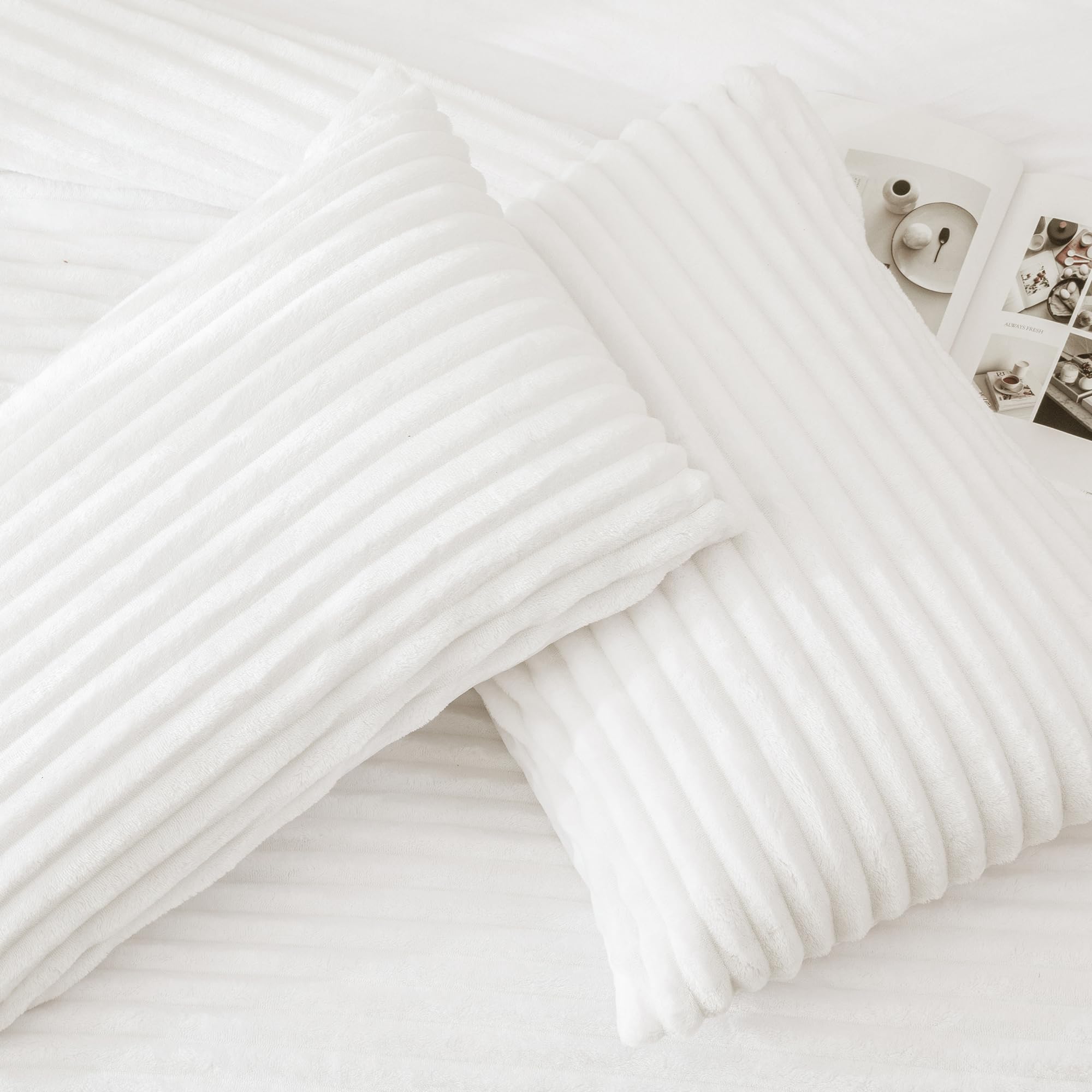 Andency comforter styled on queen bed in bedroom showing luxe decor impact