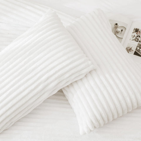 Andency comforter styled on queen bed in bedroom showing luxe decor impact