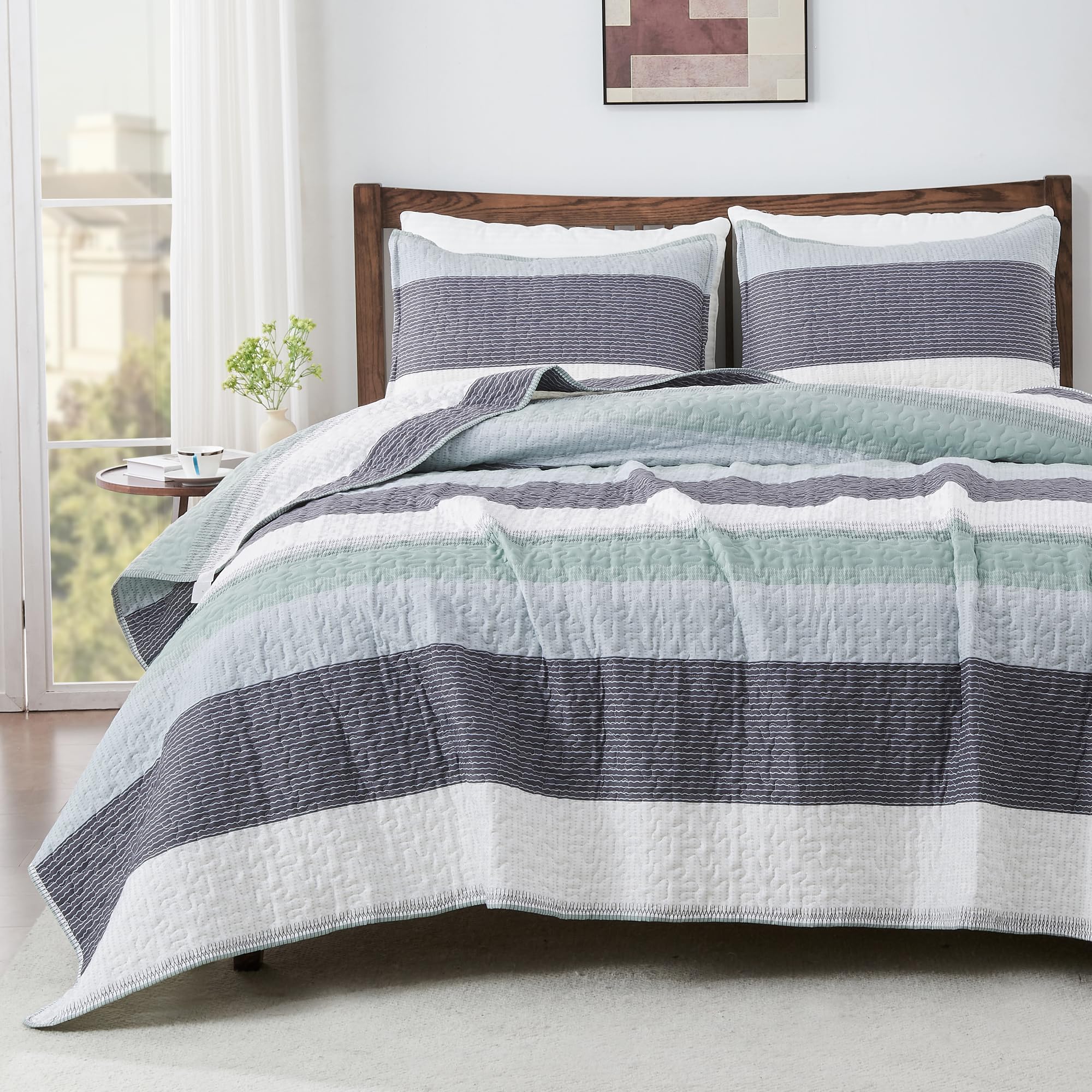 Andency front view of sage green striped quilt set showing neat modern styling and benefit