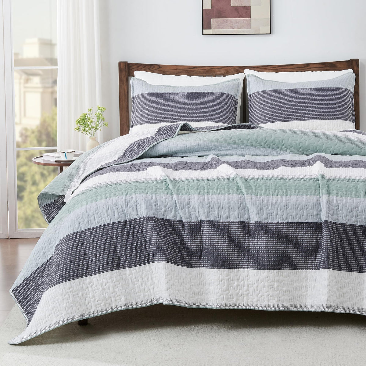 Andency front view of sage green striped quilt set showing neat modern styling and benefit