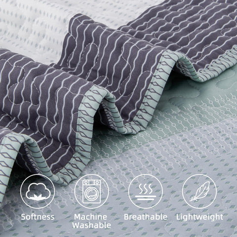 Andency king quilt draped on bed illustrating full coverage and elegant fall