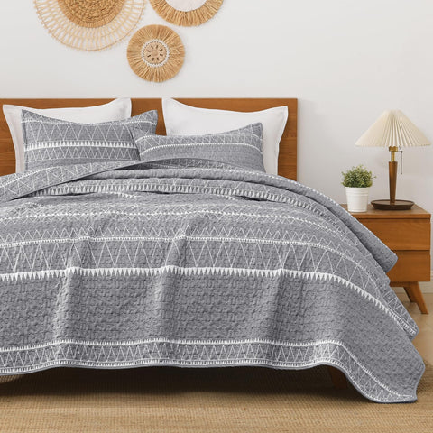 Andency king quilt front view showing grey boho stripes and full bed coverage benefit