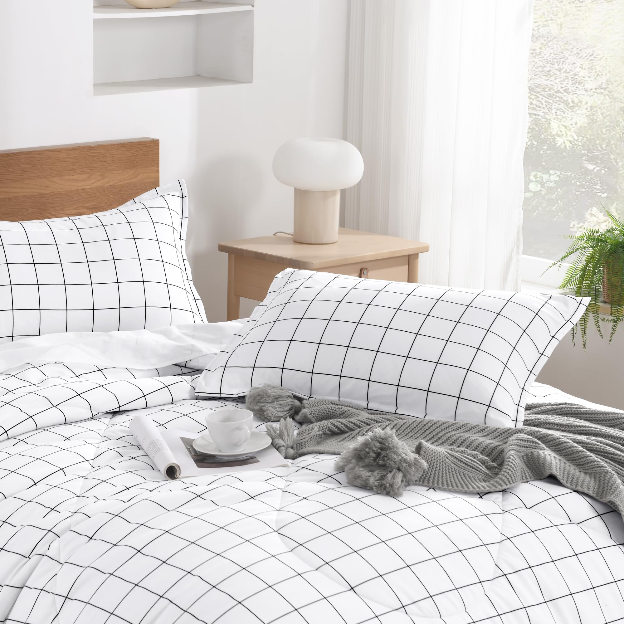 Andency comforter on full bed in bedroom creates bright, tidy aesthetic