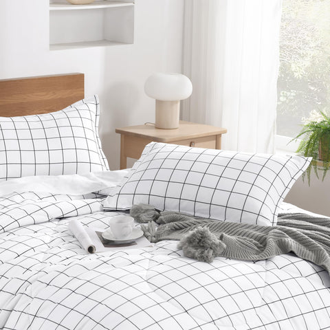 Andency comforter on full bed in bedroom creates bright, tidy aesthetic