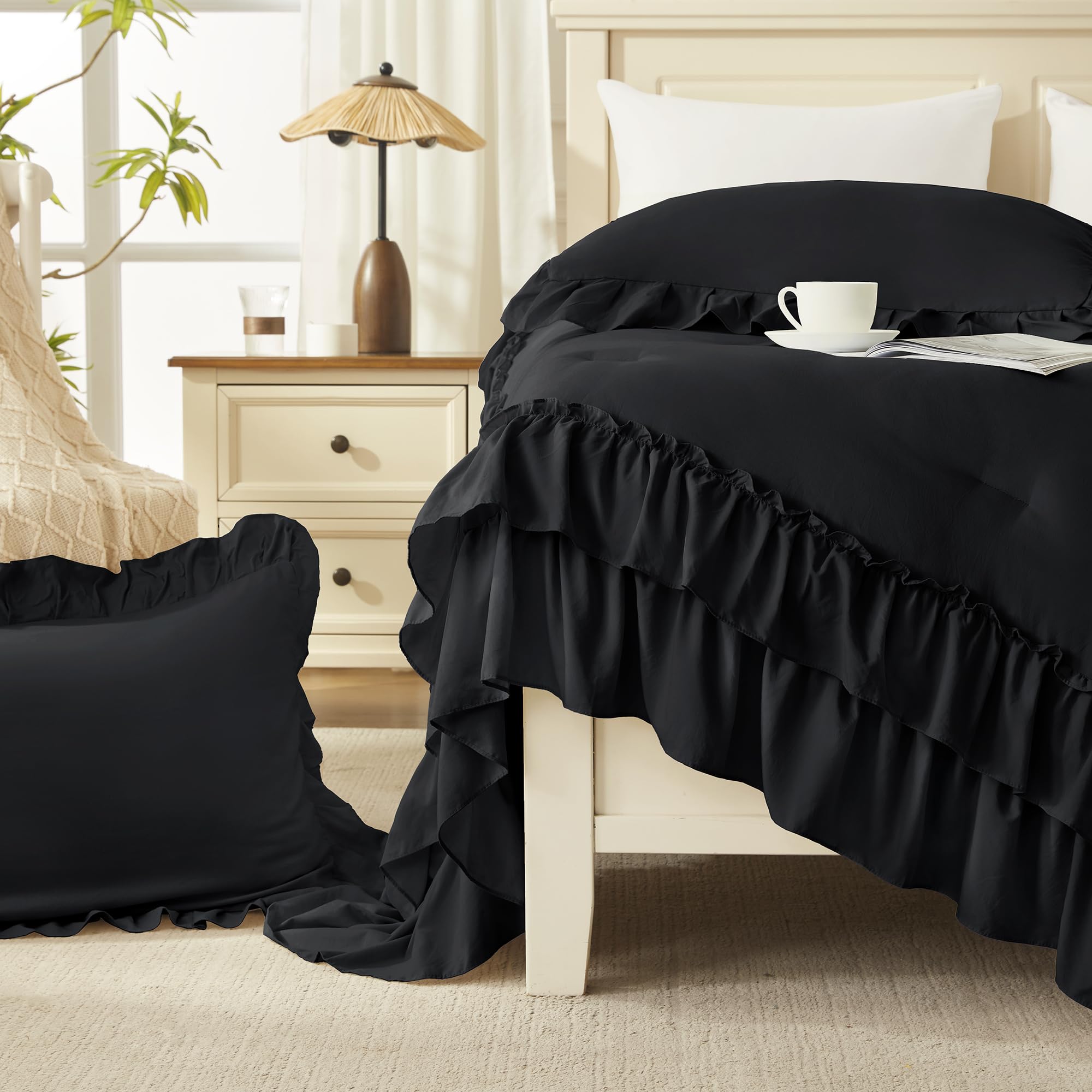 Andency on queen bed showing size and generous side drape