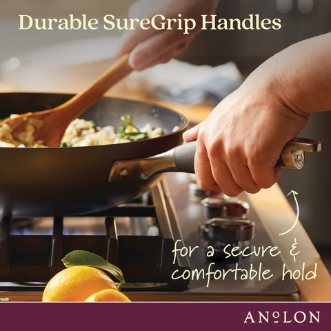Anolon helper handle close-up showing two-handed lift safety and control
