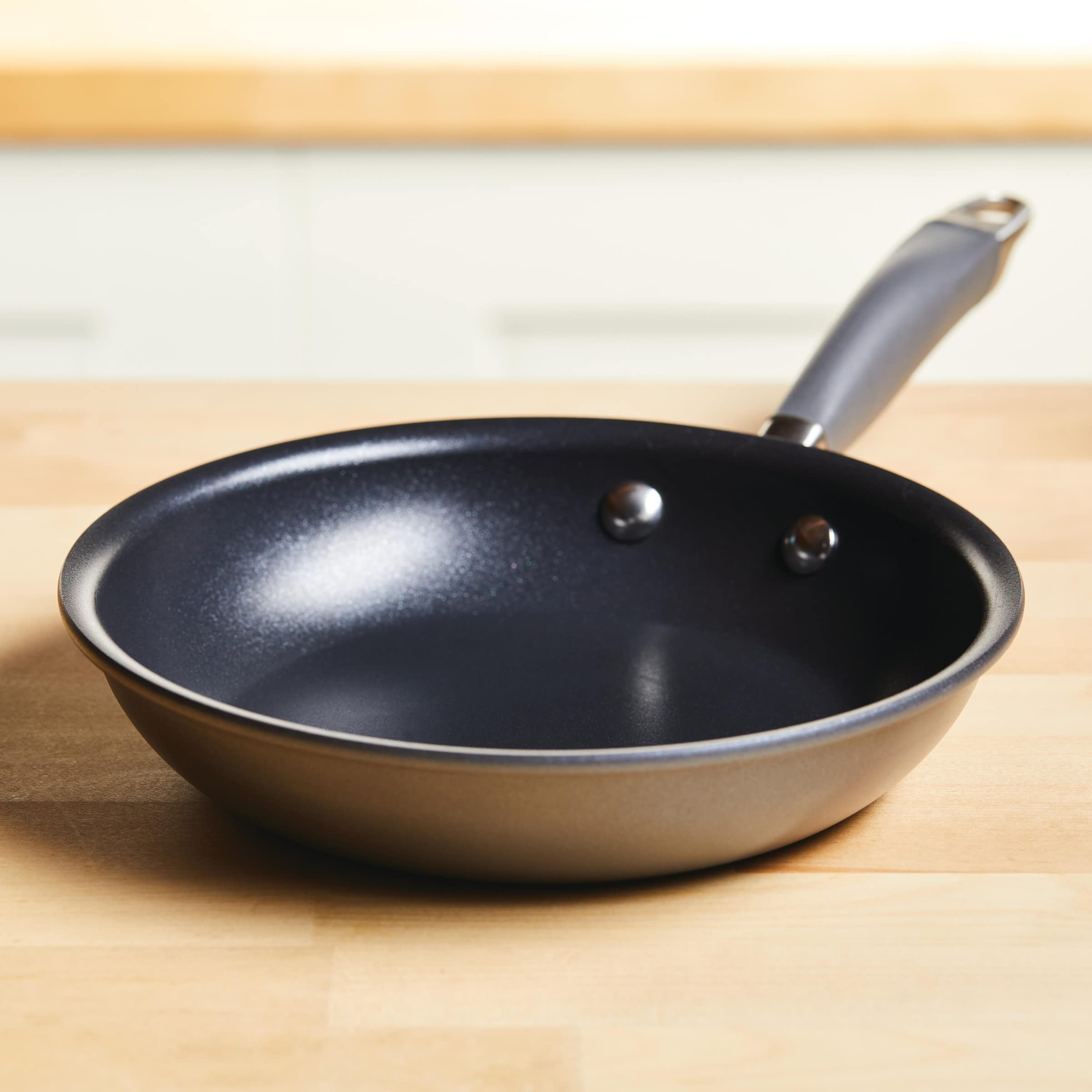 Anolon skillet inside an oven demonstrating oven-safe to 400°F versatility benefit