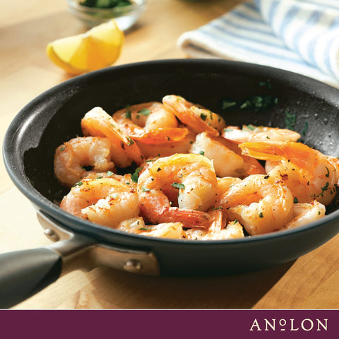 Anolon pan next to a dinner plate showing 8.5-inch scale for single-serve meals benefit