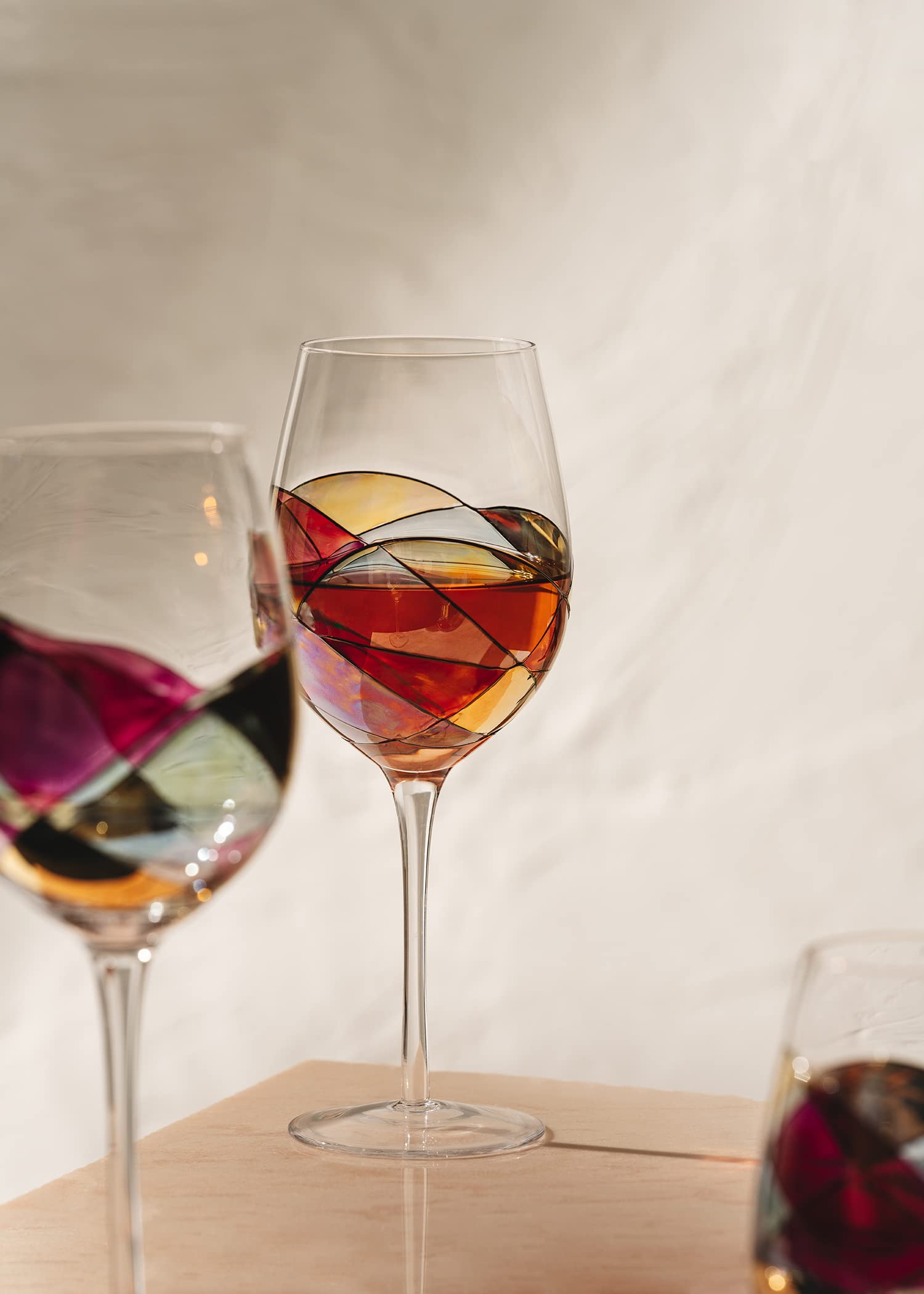 Antoni Barcelona glass held in hand showing 29 oz scale and generous wine capacity