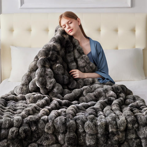Anysay throw styled on bed offering layered warmth and refined bedroom decor