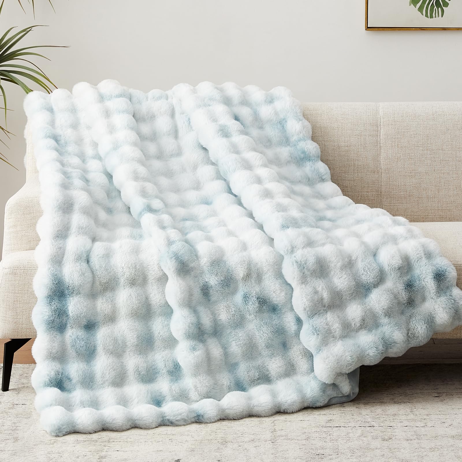 Anysay throw draped on sofa adding style and comfortable seating