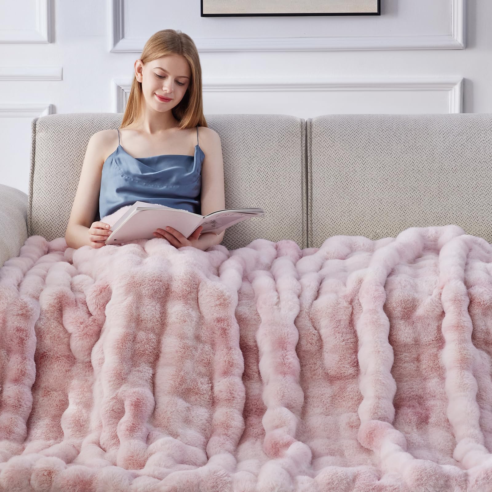Anysay blanket draped on sofa illustrating warm, stylish living space