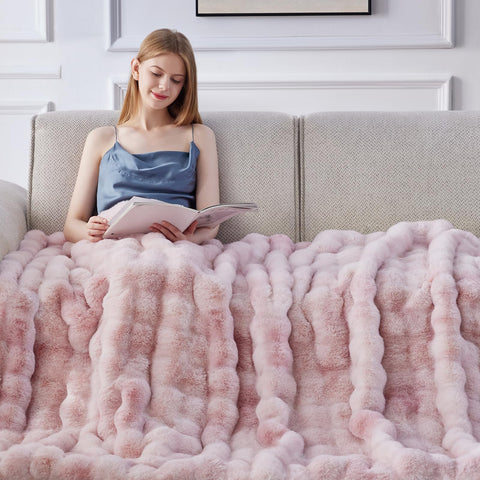 Anysay blanket draped on sofa illustrating warm, stylish living space