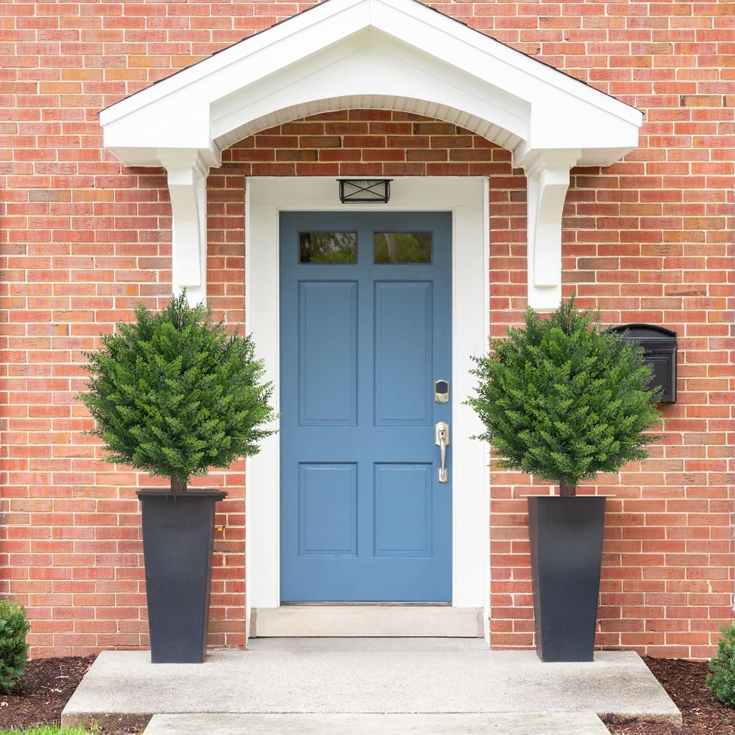 AOKIIE patio scene with two topiaries showing seasonal decor and low maintenance benefit