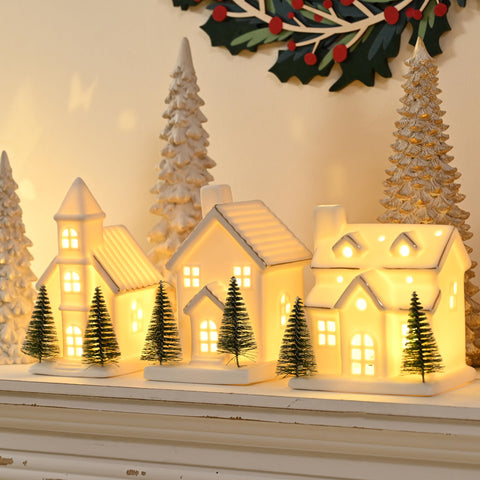 AOMOONOA front view of three white ceramic houses adding warm holiday charm