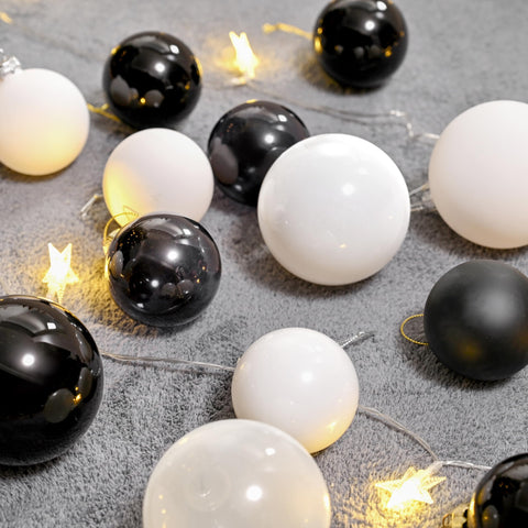 AOMOONOA ornaments hanging on a Christmas tree adding cohesive neutral elegance