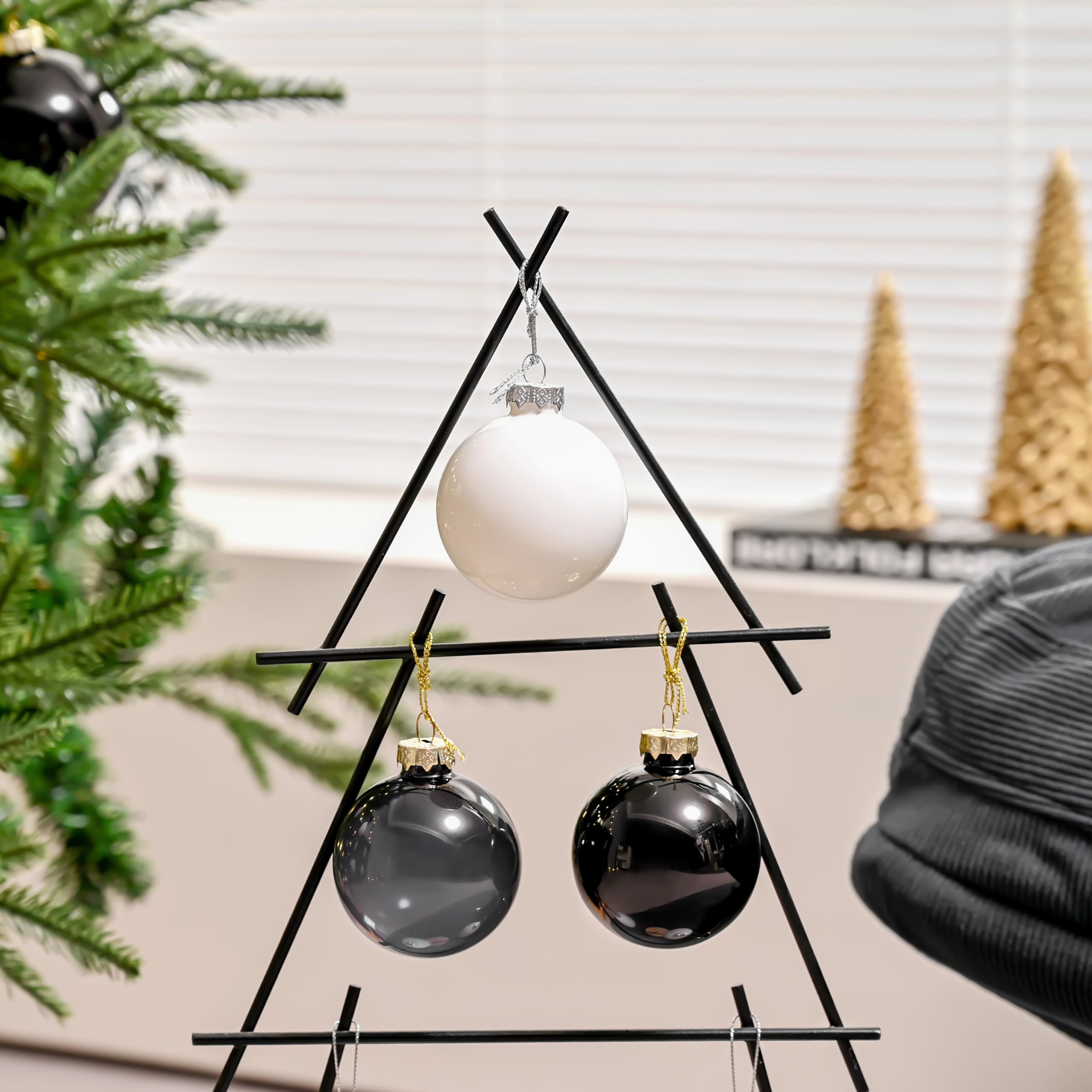 AOMOONOA white glass baubles styled on a wreath and garland for layered decor