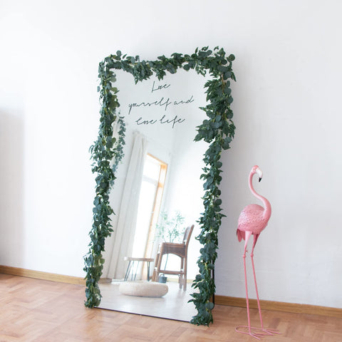 Apeair vines hanging over a mantel adding year-round greenery benefit