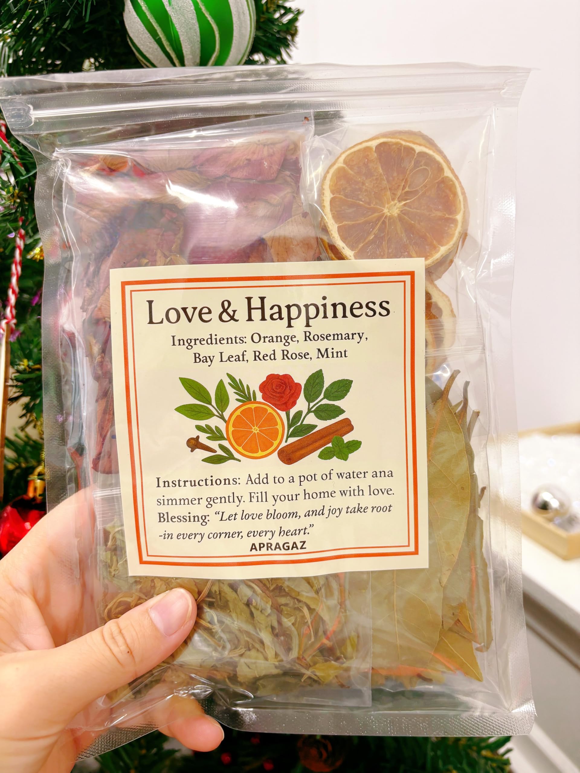 Apragaz sachet close-up revealing dried botanicals and clear ingredients