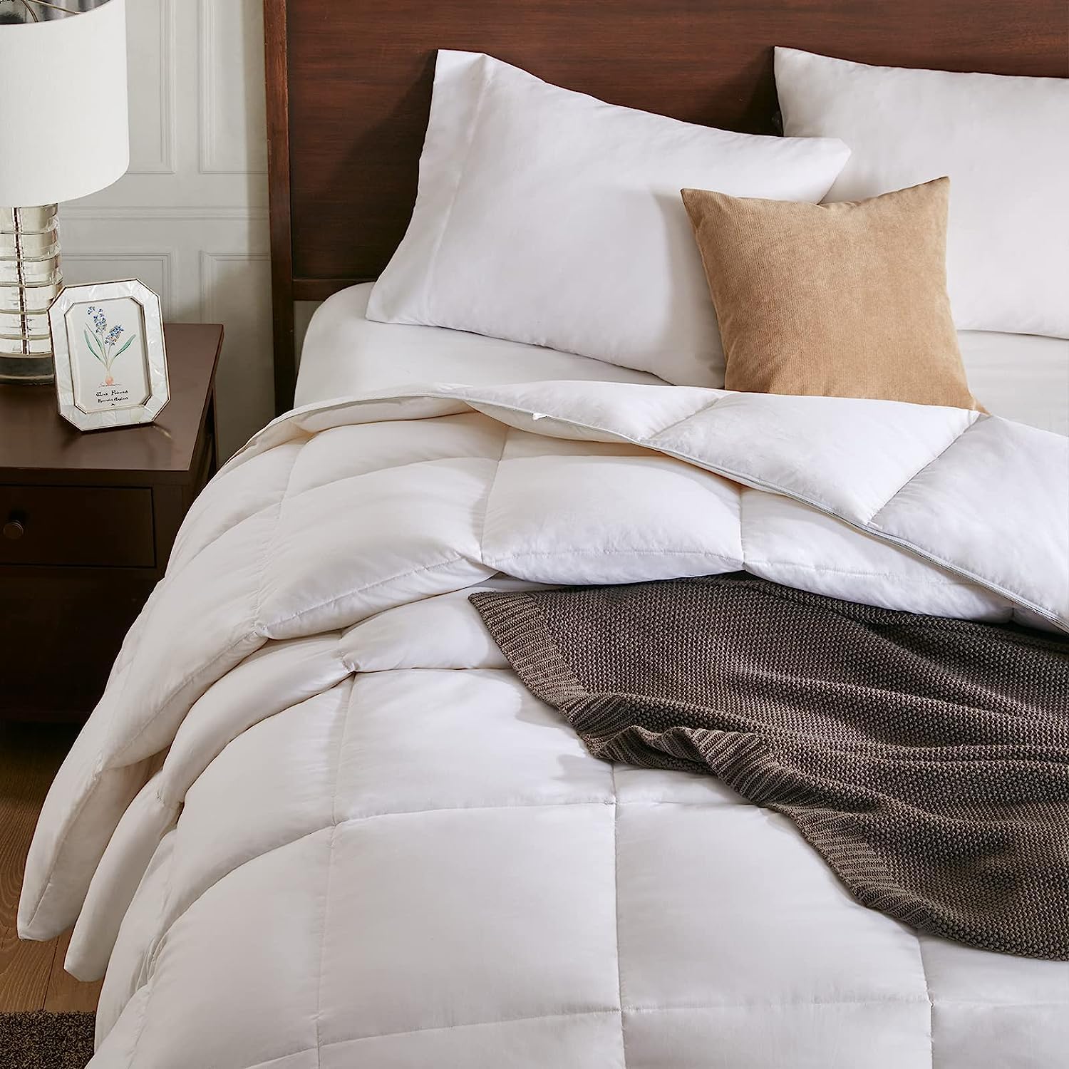APSMILE comforter in a styled bedroom showing cozy ambiance and hotel-inspired design