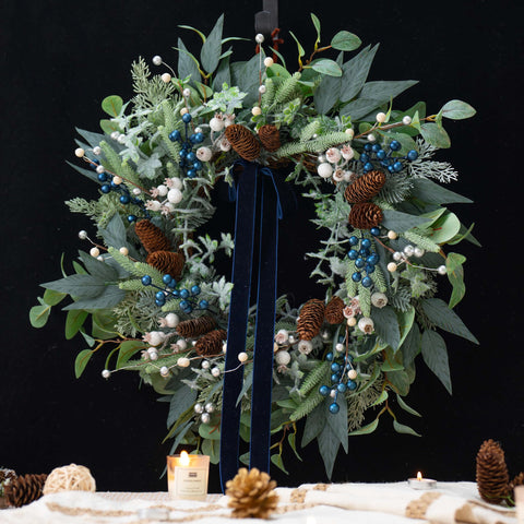 ArcadiaArt wreath hung on a front door creating warm welcome and holiday charm
