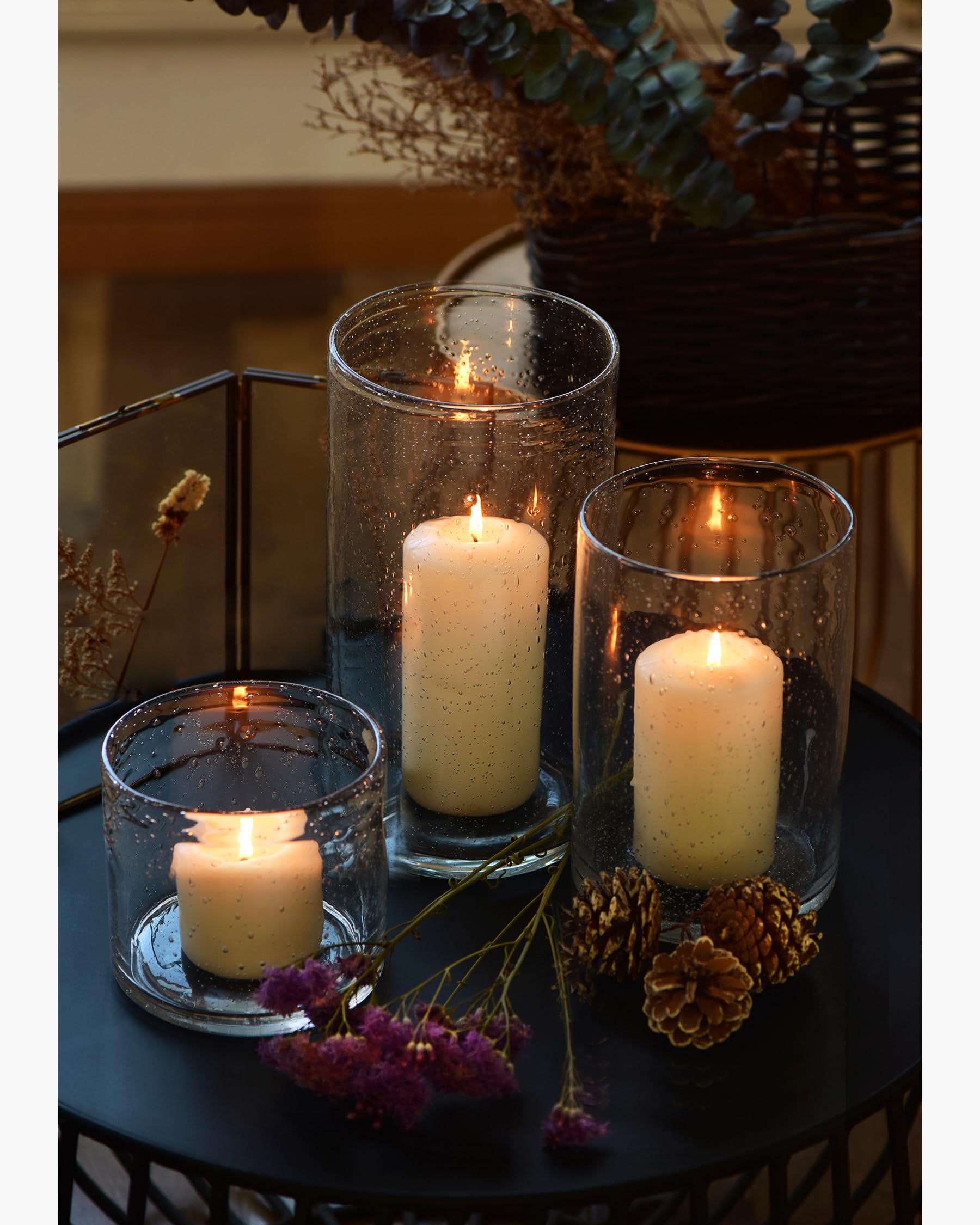 ARIAMOTION 10-inch cylinder holding a pillar candle for soft ambiance