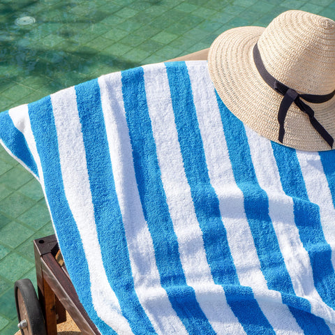 Arkwright towel draped on beach chair demonstrating oversized comfort benefit