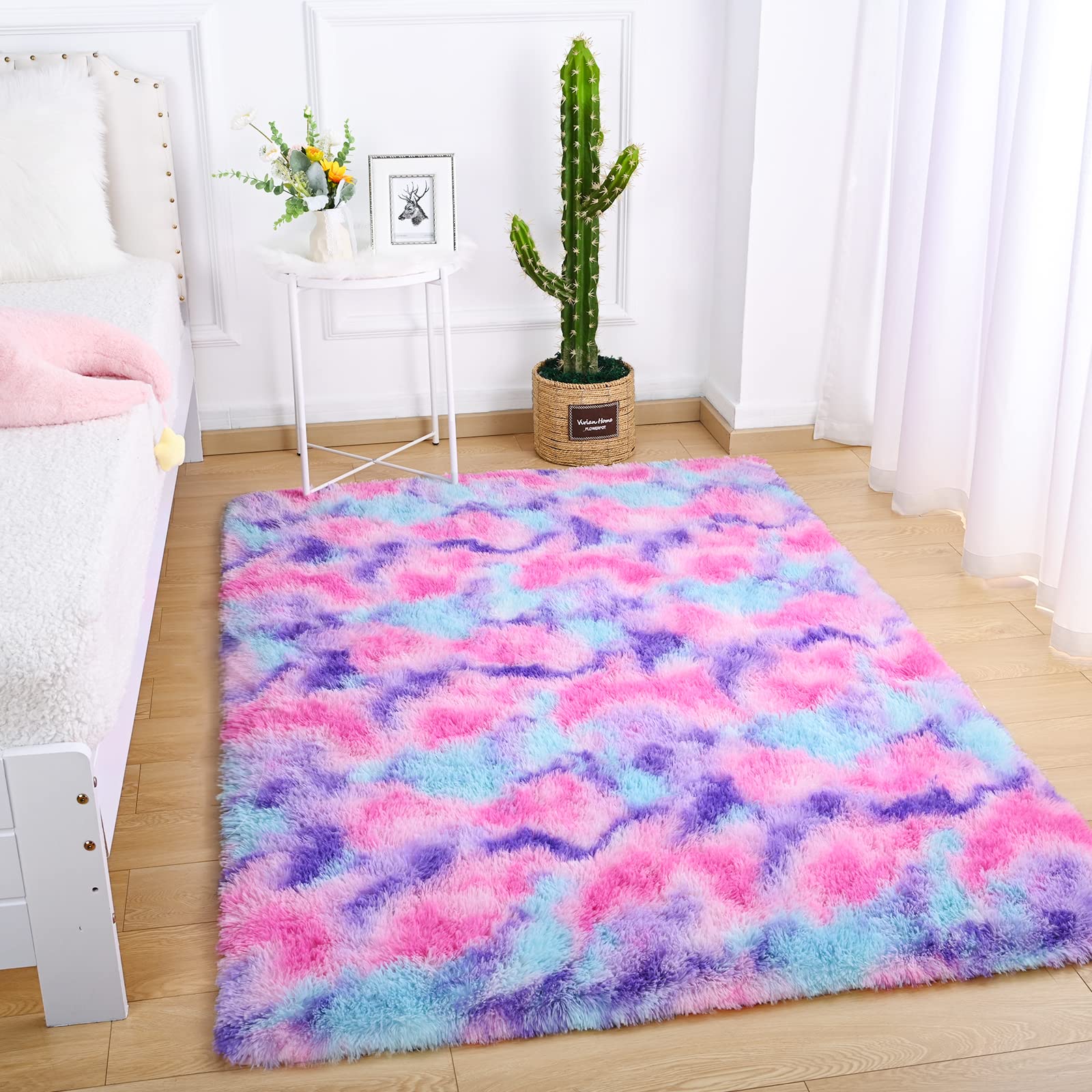 AROGAN rug being vacuumed with handheld cleaner for easy maintenance