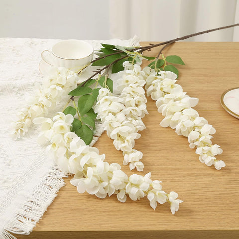 AROIUO wisteria styled in a tall vase adding instant entryway elegance