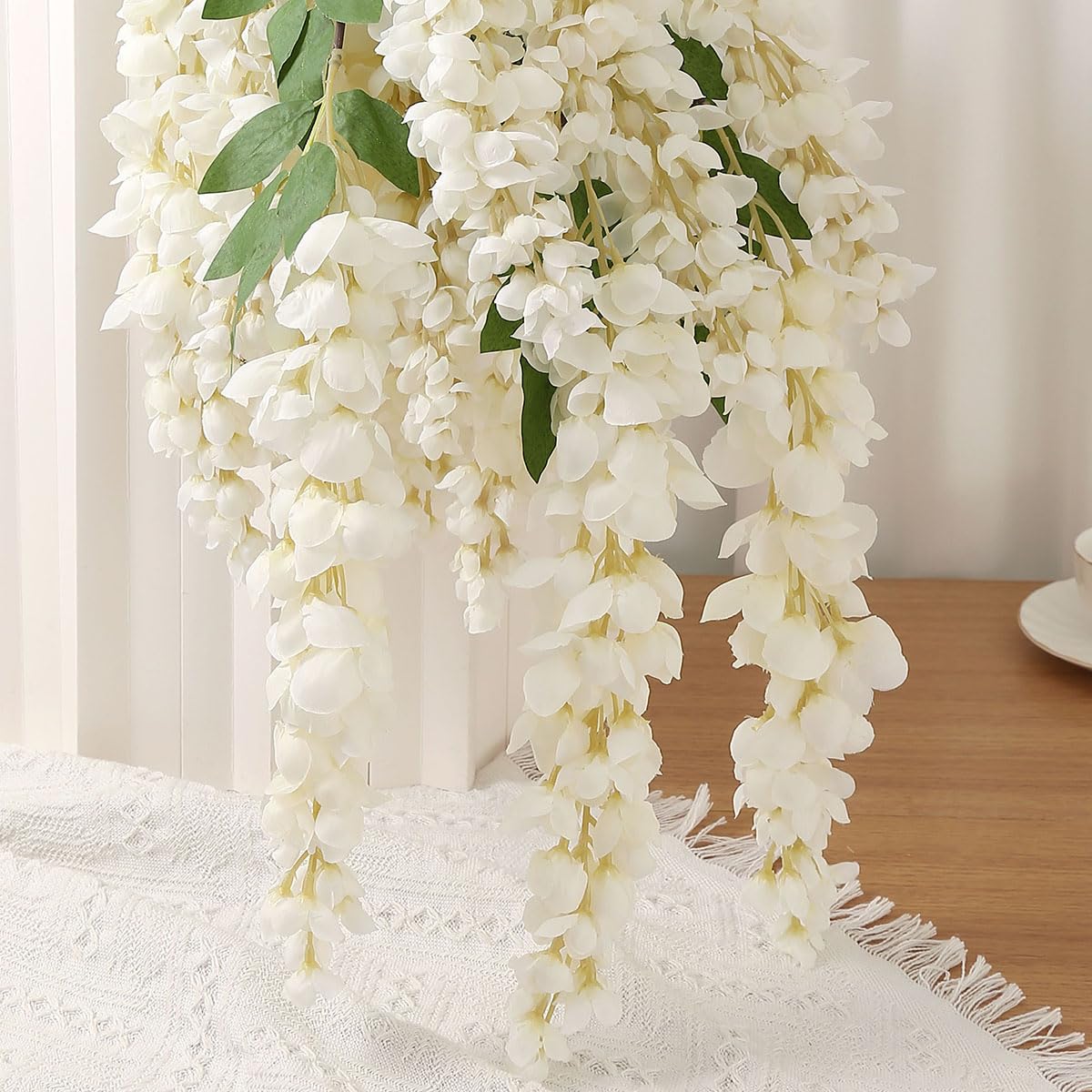 AROIUO floral arch with wisteria creating a wedding focal point