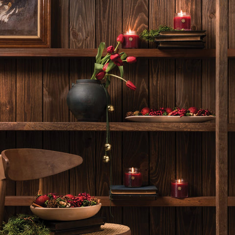 Aromatique texture shot of red berries and evergreen sprigs showing seasonal color and depth